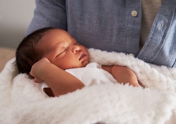 Image shows a sleeping baby