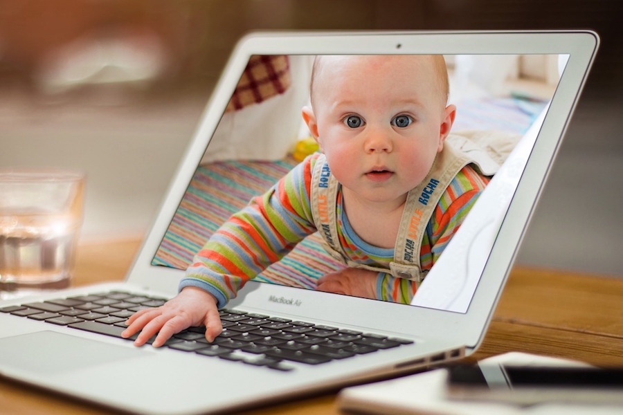 Shows an image of a baby crawling out of a computer screen