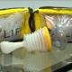 Shows a LifeVac anti-choking device with packaging