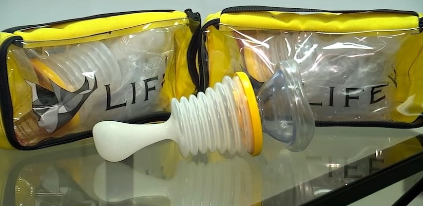Shows a LifeVac anti-choking device with packaging