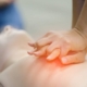 Shows two clasped hands performing CPR on a CPR mannequin